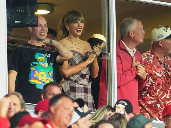 Taylor Swift cheers from a VIP suite at Arrowhead Stadium on October 7, 2024.