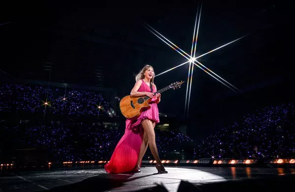 Taylor Swift performs during the Eras Tour in Liverpool, England.