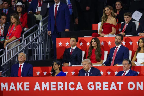 Bettina Anderson, wearing a red pantsuit, was seated behind Donald Trump Jr. and Kimberly Guilfoyle at the Republican National Convention