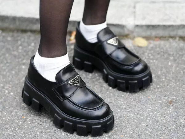 Shoes with a big Prada logo don't fit the trend of quiet luxury.