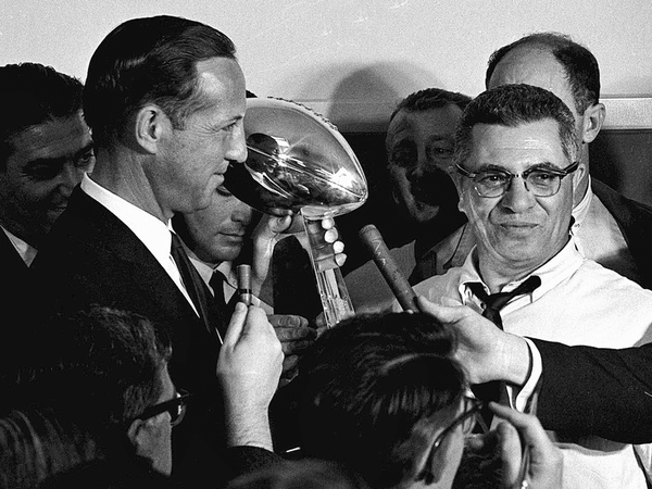 Green Bay Packers coach Vince Lombardi accepts the trophy at the 1967 Super Bowl.