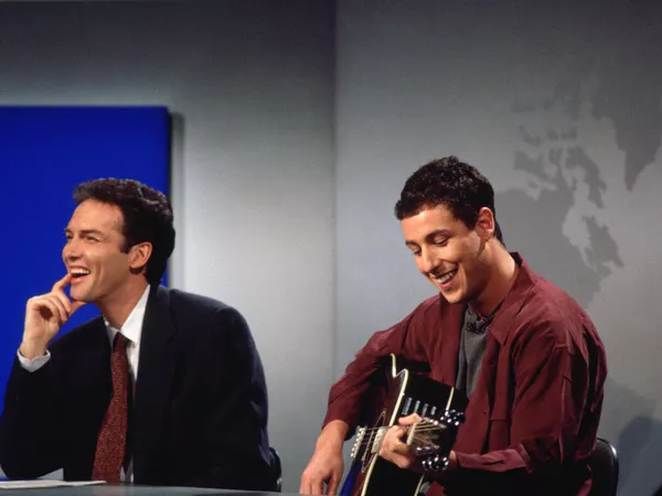 Norm MacDonald during Adam Sandler's performance of 'The Hanukkah Song' on Weekend Update in '1994. Alan Singer/NBCU Photo Bank/NBCUniversal/Getty Images